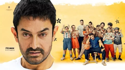 Aamir Khan comforting a young boy in a school art room scene from Sitaare Zameen Par.
