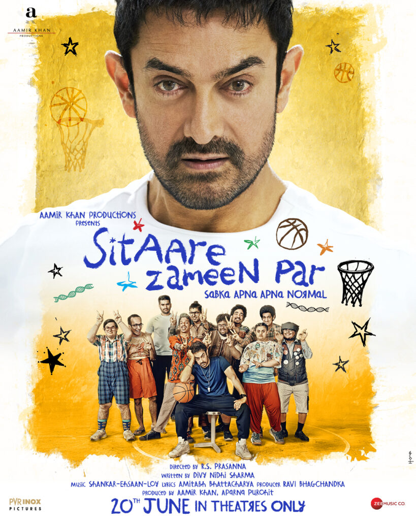 Aamir Khan comforting a young boy in a school art room scene from Sitaare Zameen Par.